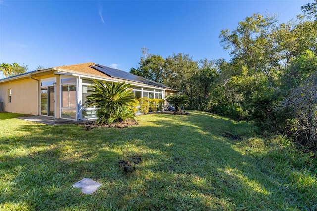 view of yard featuring a sunroom