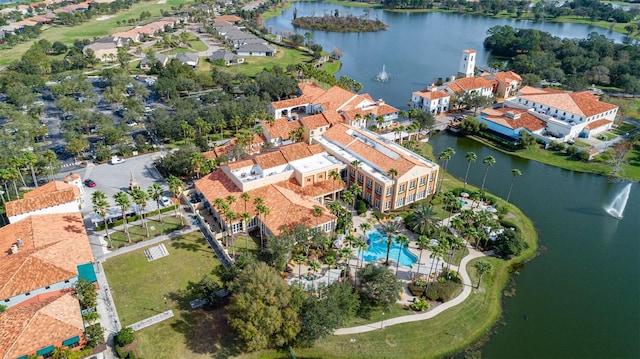 birds eye view of property with a water view