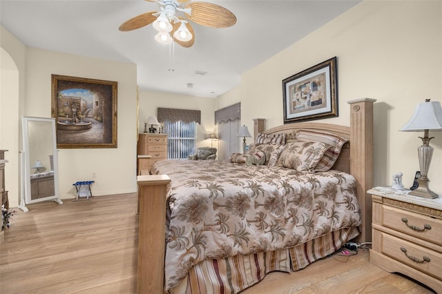 bedroom with ceiling fan and light hardwood / wood-style flooring