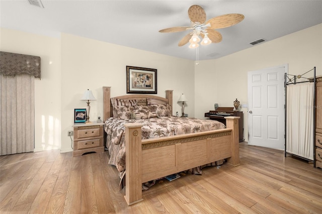 bedroom with ceiling fan and light hardwood / wood-style floors