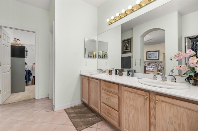 bathroom with tile patterned flooring and vanity