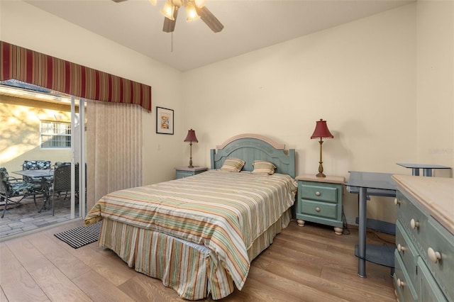 bedroom featuring ceiling fan, light wood-type flooring, and access to outside