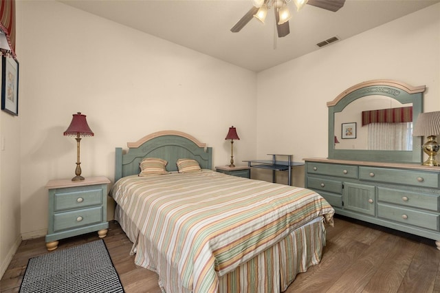 bedroom featuring ceiling fan and dark wood-type flooring