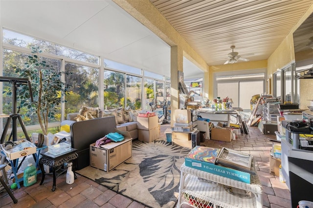 sunroom with ceiling fan