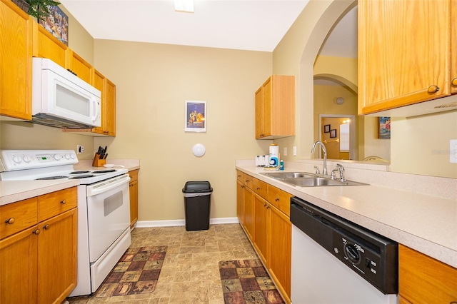 kitchen featuring sink and white appliances