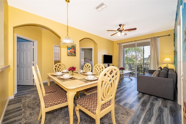 dining room with dark hardwood / wood-style floors and ceiling fan