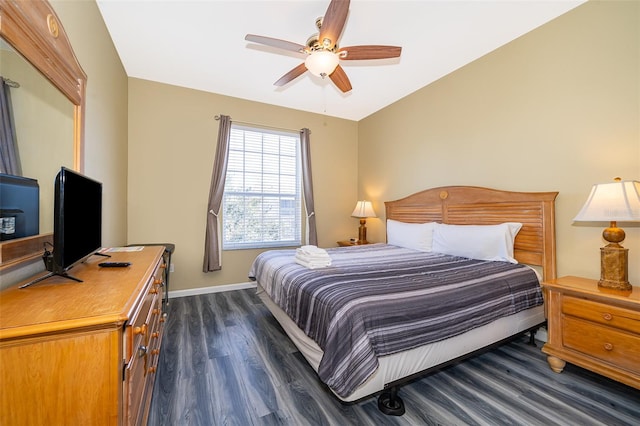 bedroom featuring ceiling fan and dark wood-type flooring