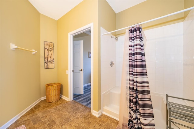 bathroom with a shower with curtain