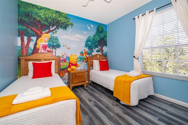 bedroom featuring dark hardwood / wood-style floors and ceiling fan