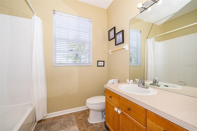 full bathroom with vanity, toilet, and shower / bath combo with shower curtain