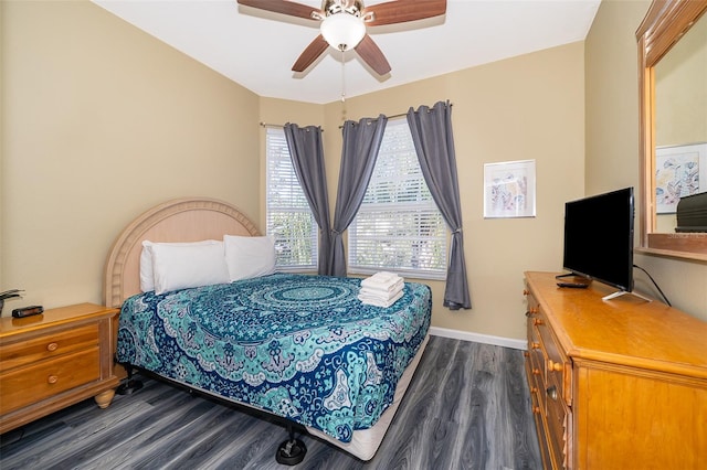 bedroom featuring ceiling fan and dark hardwood / wood-style flooring