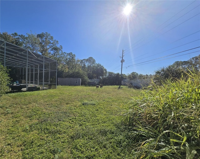 view of yard featuring a lanai