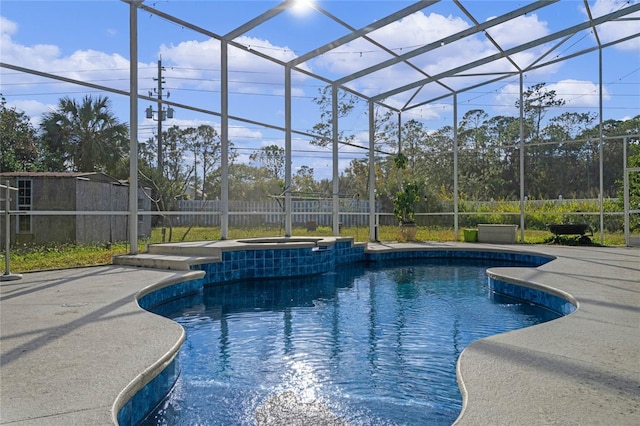 view of swimming pool with a lanai, an in ground hot tub, and a patio