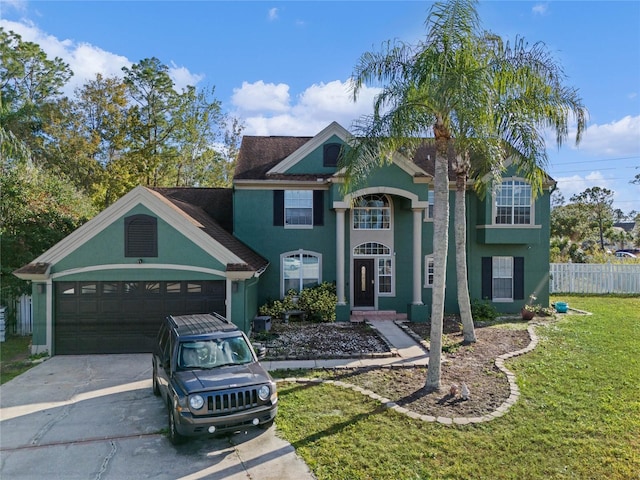 view of front facade with a front yard and a garage