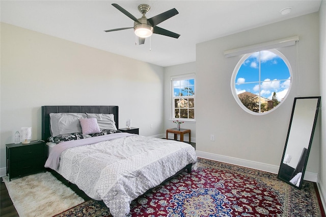 bedroom featuring hardwood / wood-style flooring and ceiling fan