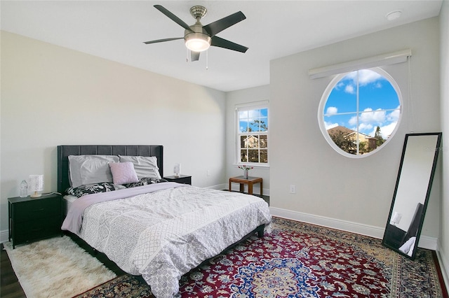 2811 Sonata Ct, Saint Cloud, FL 34772 - bedroom with baseboards, a ceiling fan, and wood finished floors