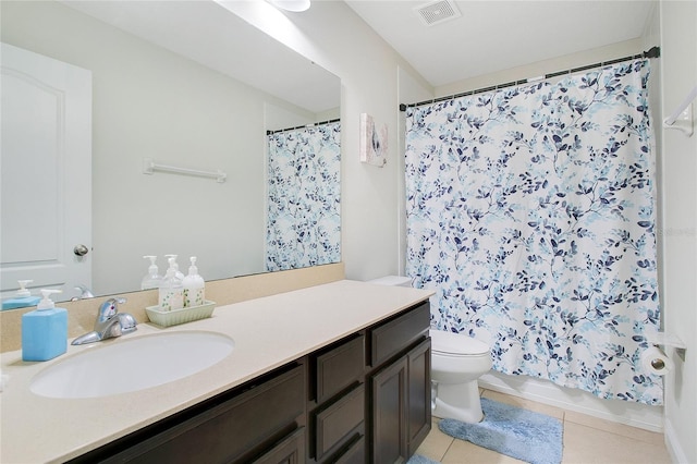 bathroom with curtained shower, tile patterned flooring, vanity, and toilet