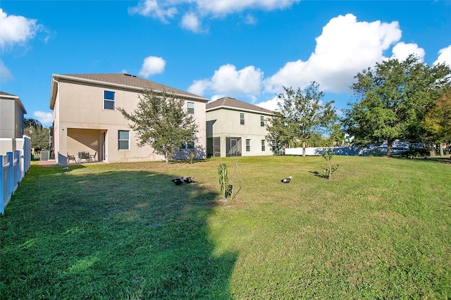2811 Sonata Ct, Saint Cloud, FL 34772 - rear view of property with stucco siding and cooling unit