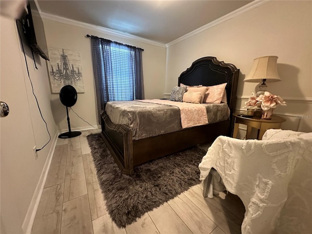 bedroom featuring hardwood / wood-style flooring and ornamental molding