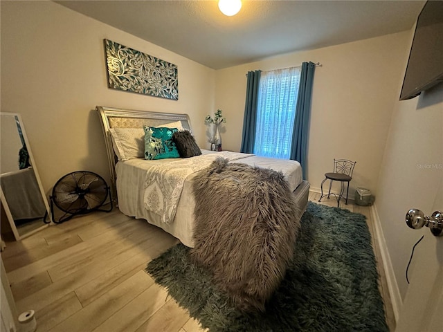 bedroom with light wood-type flooring