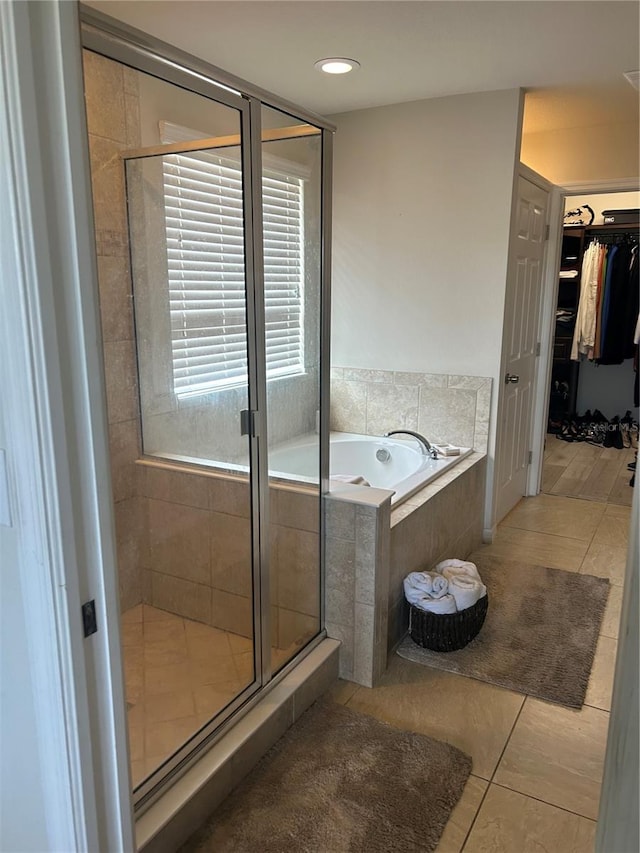 bathroom with tile patterned flooring and plus walk in shower