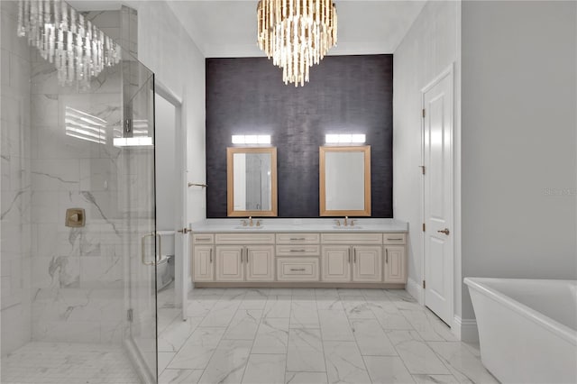 bathroom with vanity, independent shower and bath, and a notable chandelier