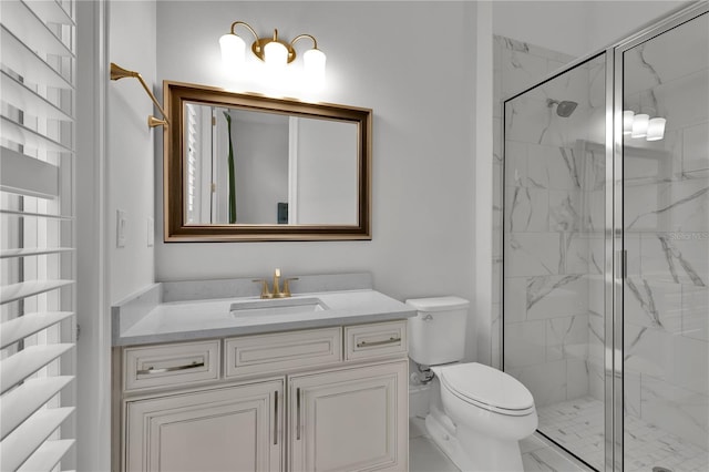 bathroom with vanity, toilet, and an enclosed shower