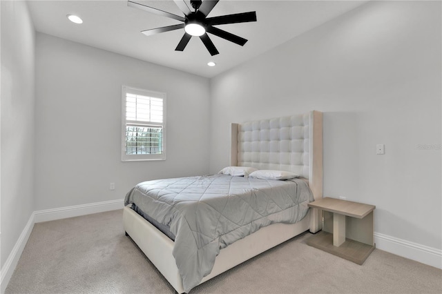 bedroom featuring ceiling fan and light colored carpet