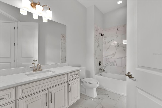 full bathroom with vanity, tiled shower / bath combo, and toilet