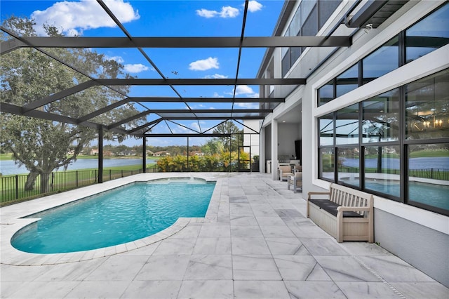 view of pool featuring a lanai, a patio area, and a water view