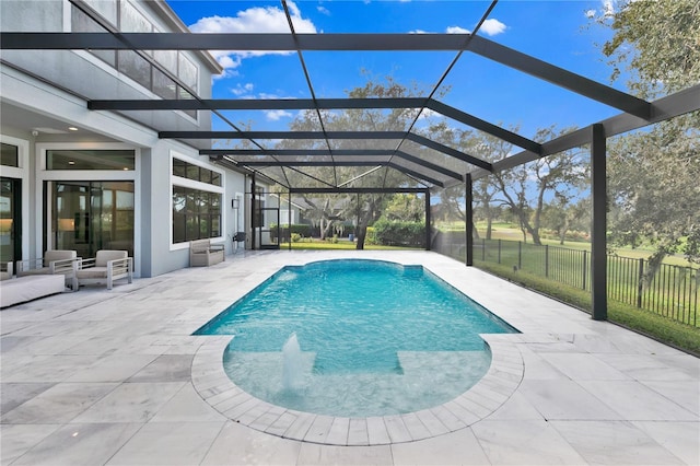 view of swimming pool with a lanai and a patio