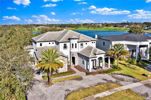 birds eye view of property with a water view