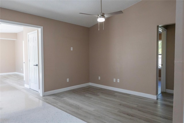 empty room featuring hardwood / wood-style floors and ceiling fan