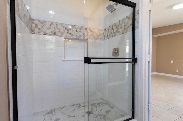 bathroom with a shower with shower door