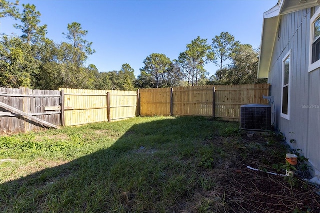 view of yard featuring central air condition unit