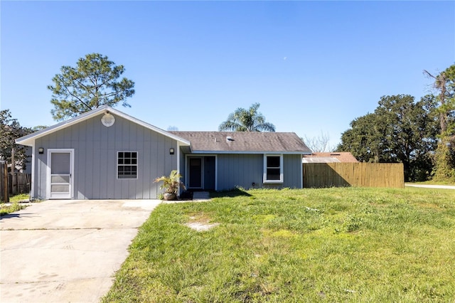 ranch-style house with a front lawn