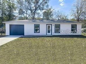 single story home with a front yard and a garage