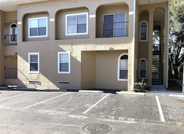 8846 Coral Palms Ct Unit A, Kissimmee, FL 34747 - view of front of home with uncovered parking and stucco siding
