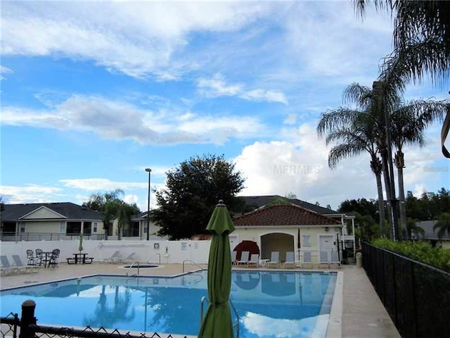 view of swimming pool with a patio area