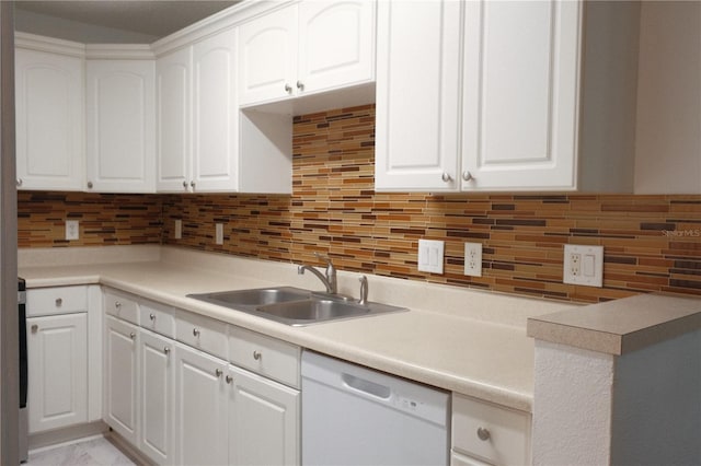 kitchen with sink, backsplash, white cabinets, and white dishwasher