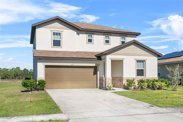 view of front of house with a garage and a front yard