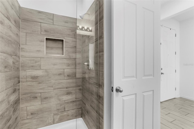 bathroom with tiled shower