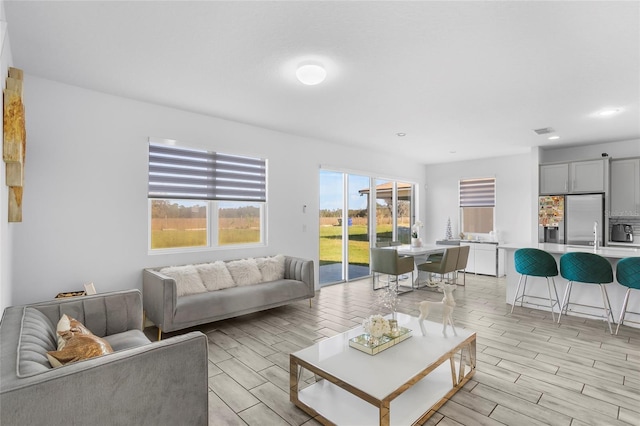 living room with light hardwood / wood-style flooring