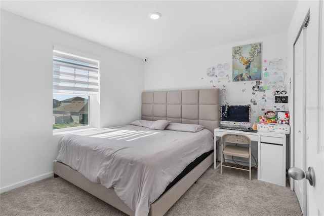 bedroom with light carpet