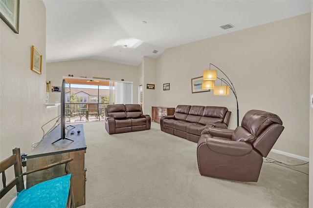 living room with carpet floors and lofted ceiling