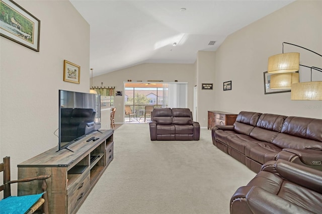 carpeted living room featuring lofted ceiling