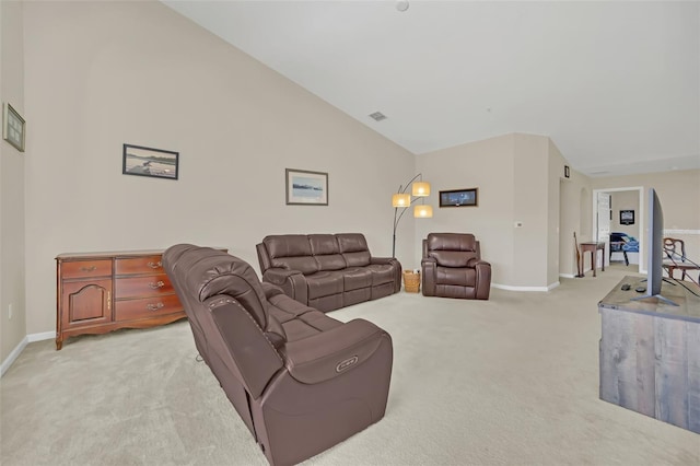 carpeted living room featuring lofted ceiling