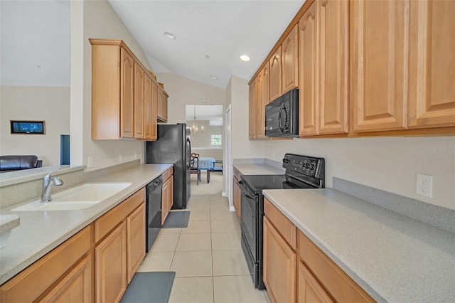 kitchen featuring vaulted ceiling, sink, black appliances, light tile patterned floors, and a chandelier