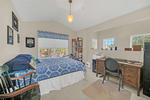 bedroom with vaulted ceiling, light colored carpet, and multiple windows