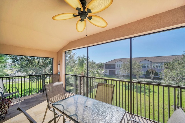 sunroom / solarium with vaulted ceiling and ceiling fan